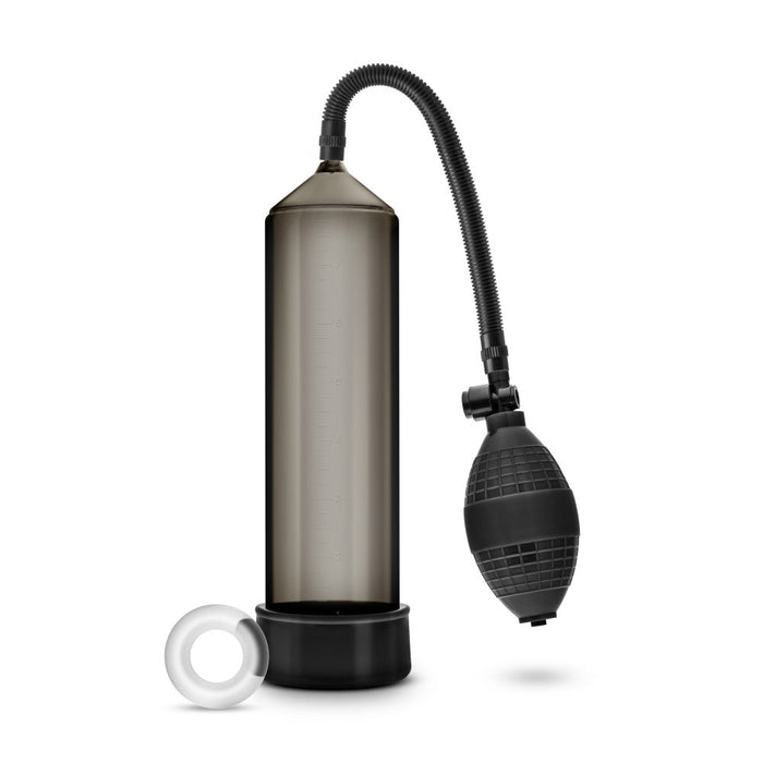 Black cylinder that connects to a squeezable ball pump by a black flexible hose. Includes black pump sleeve and stretchy cock ring. Additional images show alternate angles.