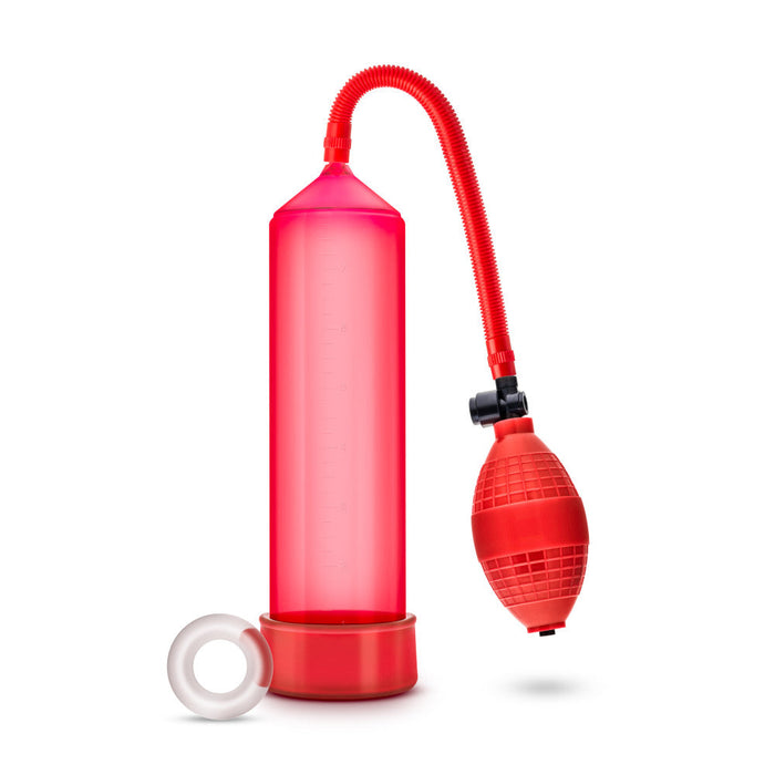 Red cylinder that connects to a squeezable ball pump by a red flexible hose. Includes red pump sleeve and stretchy cock ring. Additional images show alternate angles.