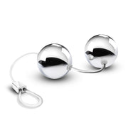 Two smooth, small, silver plastic Kegel balls connected by a clear cord with a loop at the bottom for easy retrieval. Additional images show alternate angles.