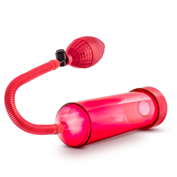 Red cylinder that connects to a squeezable ball pump by a red flexible hose. Includes red pump sleeve and stretchy cock ring.  Additional images show alternate angles.