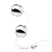 Two smooth, small, silver plastic Kegel balls connected by a clear cord with a loop at the bottom for easy retrieval. Additional images show alternate angles.